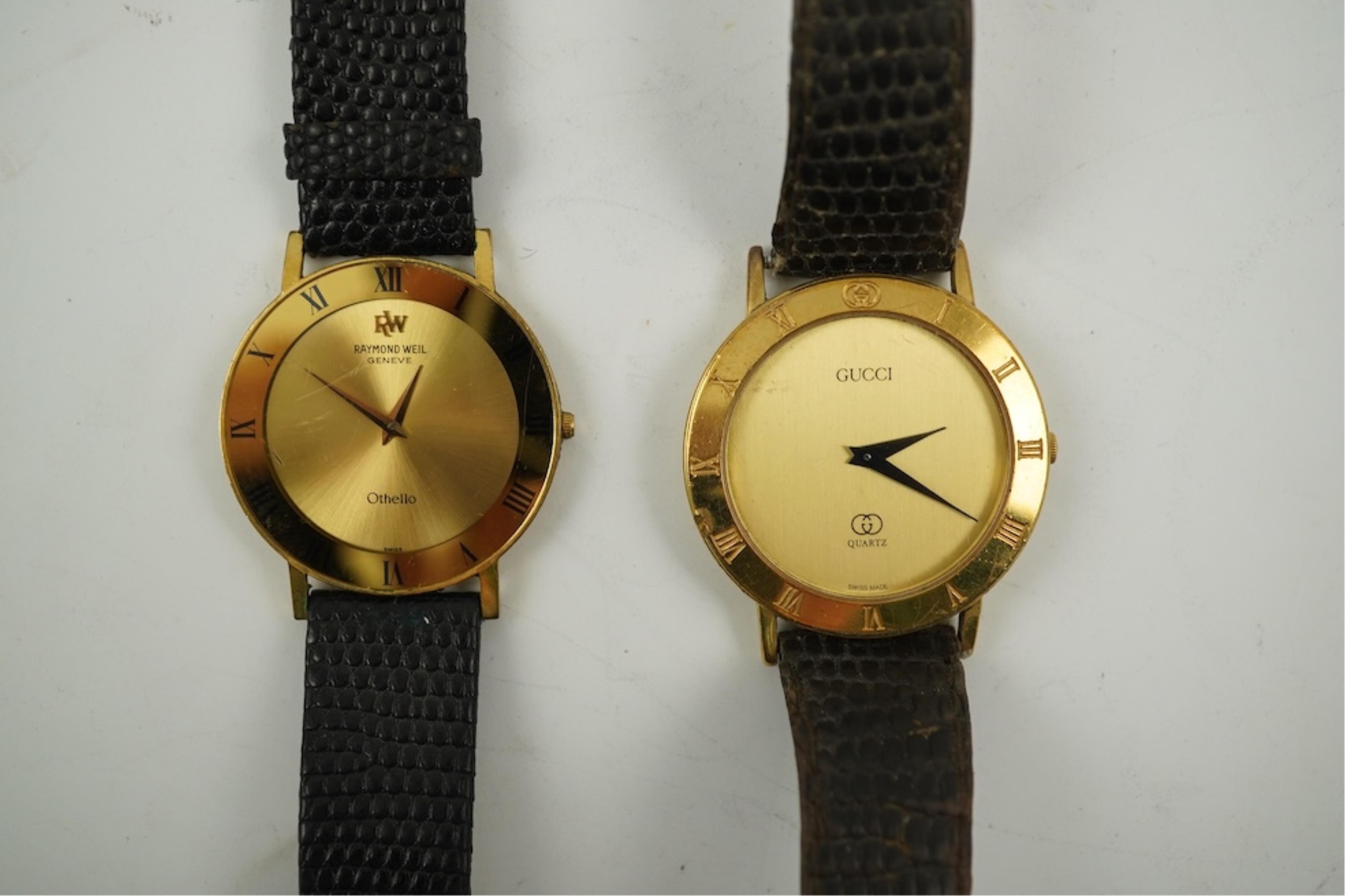 A gentleman's recent 18k gold electro-plated Raymond Weil quartz dress wrist watch, case diameter 33mm and a similar Gucci quartz dress wrist watch.